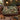 Acanthus Pheasant woven blanket draped over a sofa or armchair