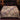 Aster Cottage Gate Garden botanical woven blanket spread across a bed