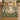 Beech Ruined Cloister botanical woven blanket spread across a bed
