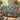 Bluebird Camellia Magnolia Garden woven blanket draped over a sofa or armchair