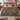 Bramble Fox botanical woven blanket spread across a bed