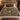 Bramble Fox botanical woven blanket spread across a bed