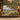 Chestnut Terrace woven blanket draped over a sofa or armchair