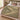 Clover Warren botanical woven blanket spread across a bed