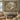Cream Sage Stream botanical woven blanket shown without a name as a wall tapestry