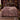 Cyclamen Rootwood botanical woven blanket spread across a bed