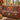 Dahlia Swallowtail Terrace woven blanket draped over a sofa or armchair