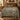 Doe Fawn Bluebell Wood botanical woven blanket spread across a bed