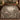 Dove Orange Allee botanical woven blanket spread across a bed