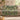 Fern and Meadowsweet woven blanket draped over a sofa or armchair