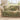 Fern and Meadowsweet woven blanket draped over a sofa or armchair