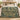 Fern Bower botanical woven blanket spread across a bed