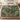 Fern Bower botanical woven blanket spread across a bed