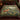 Fox Primrose Bank botanical woven blanket spread across a bed