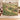 Personalized Fritillary Mosaic Meadow woven blanket styled in a home setting