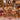 Woman holding a personalized Grinchmas christmas tree fleece blanket with custom name in a Christmas living room