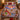 Custom name village overlook Christmas fleece blanket spread on a bed with red holiday pillows