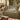 Hare Meadow woven blanket draped over a sofa or armchair