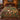 Hedgehog Cep Wood botanical woven blanket spread across a bed