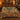 Hedgehog Cep Wood botanical woven blanket spread across a bed