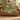 Hellebore Courtyard woven blanket draped over a sofa or armchair