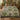 Herb Ninepatch Garden botanical woven blanket spread across a bed