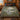 Heron Mill Pond botanical woven blanket spread across a bed