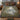 Heron Mill Pond botanical woven blanket spread across a bed