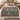 Hollyhock Court botanical woven blanket spread across a bed