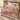 Hollyhock Court botanical woven blanket spread across a bed