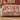 Hollyhock Court woven blanket draped over a sofa or armchair