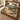 Hollyhock Court botanical woven blanket spread across a bed
