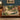 Hollyhock Court woven blanket draped over a sofa or armchair