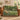Hornbeam Green Theatre woven blanket draped over a sofa or armchair