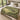 Hornbeam Green Theatre botanical woven blanket spread across a bed