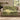 Hornbeam Green Theatre woven blanket draped over a sofa or armchair