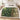 Ivy Cascade botanical woven blanket spread across a bed