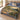 Limonaia Cypress botanical woven blanket spread across a bed