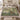 Linden Doves botanical woven blanket spread across a bed