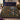 Luna Moth Moonflower Night botanical woven blanket spread across a bed