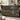Luna Moth Moonflower Night woven blanket draped over a sofa or armchair