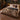 Lunaria Moon Stair botanical woven blanket spread across a bed