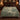 Mallard Reed Hollow botanical woven blanket spread across a bed