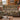 Medlar Hedgerow woven blanket draped over a sofa or armchair