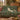 Millefleur Unicorn woven blanket draped over a sofa or armchair