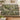 Moss Canopy woven blanket draped over a sofa or armchair