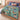 Nutcracker Story Tree Christmas woven blanket spread across a bed