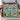 Couple holding the personalized Nutcracker Story Tree woven blanket with a custom family name