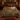 Pheasant Hedgerow Harvest botanical woven blanket spread across a bed
