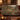 Pheasant Hedgerow Harvest woven blanket draped over a sofa or armchair